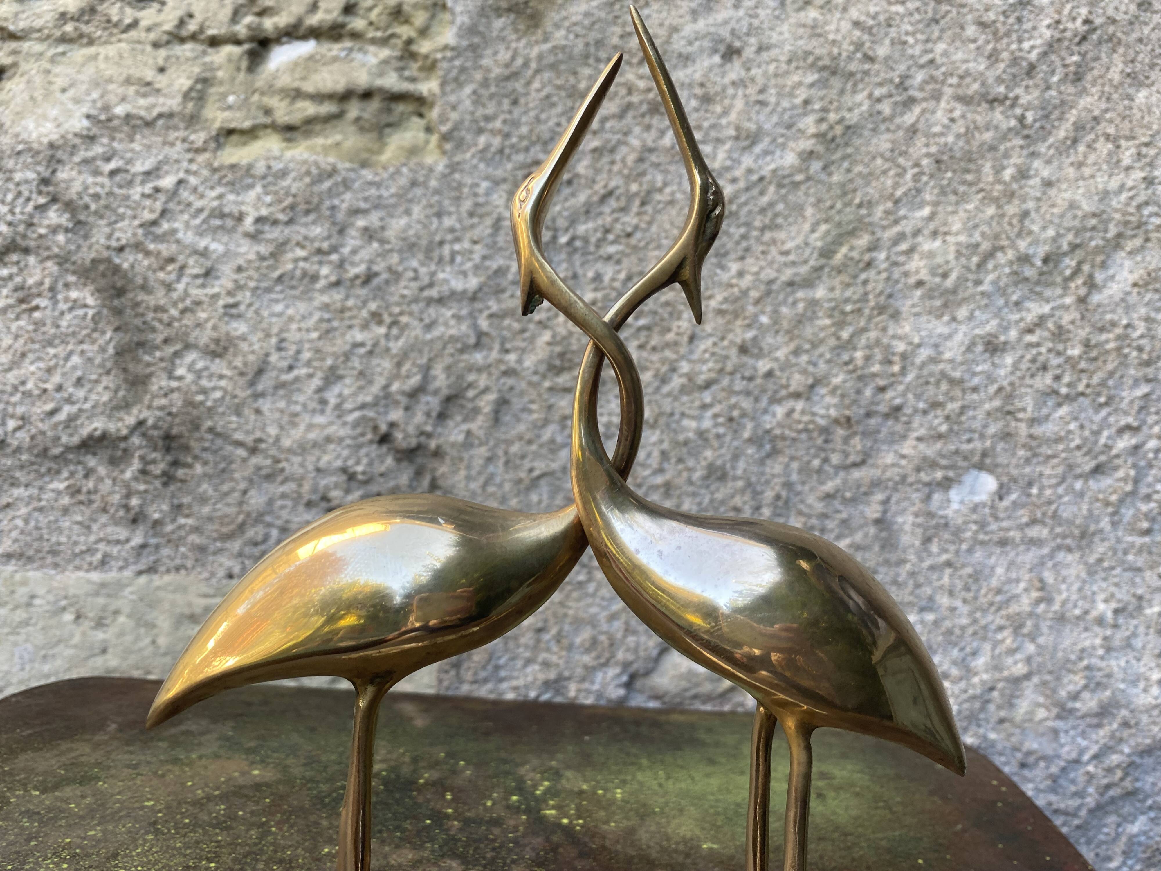 Couple of brass herons