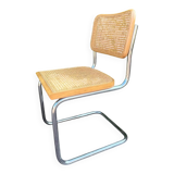 Wooden chair with caning in the style of Marcel Breuer.
