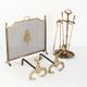 Antique bronze fire screen and fireplace accessories set. Game of seven. France, 1930s