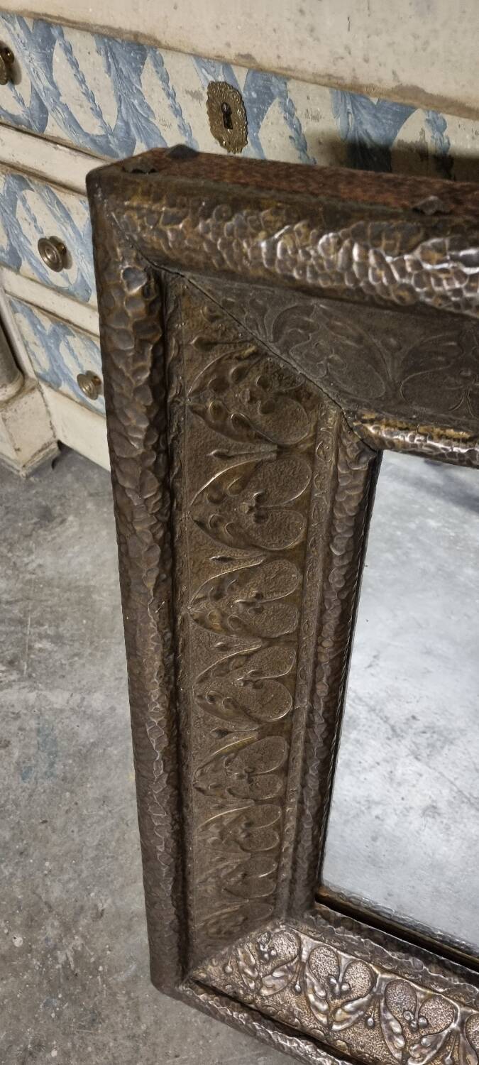 Early 20th century mirror made of stamped sheet metal