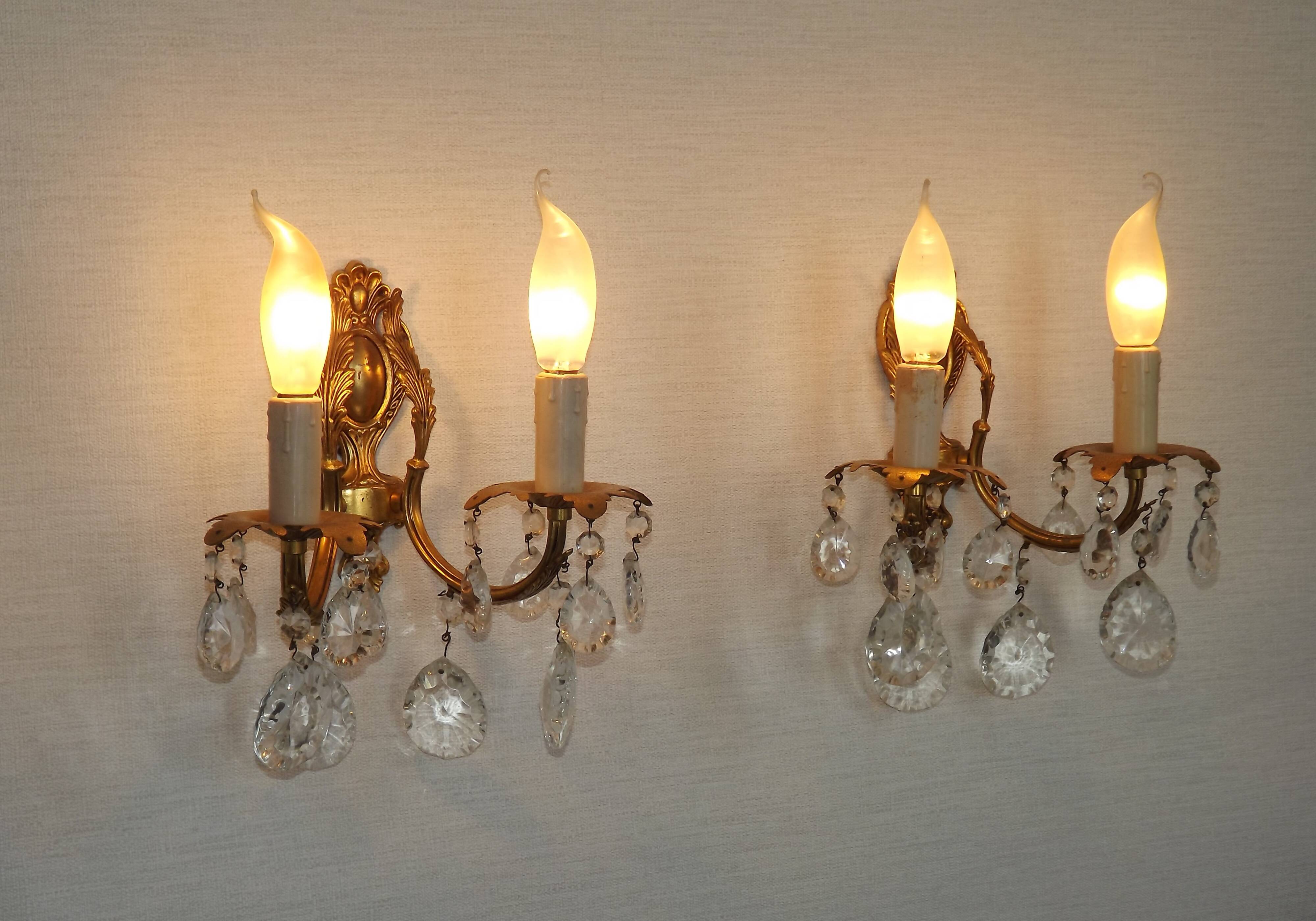 Pair of antique 2-light wall sconces in bronze with crystal pendants, Spain.