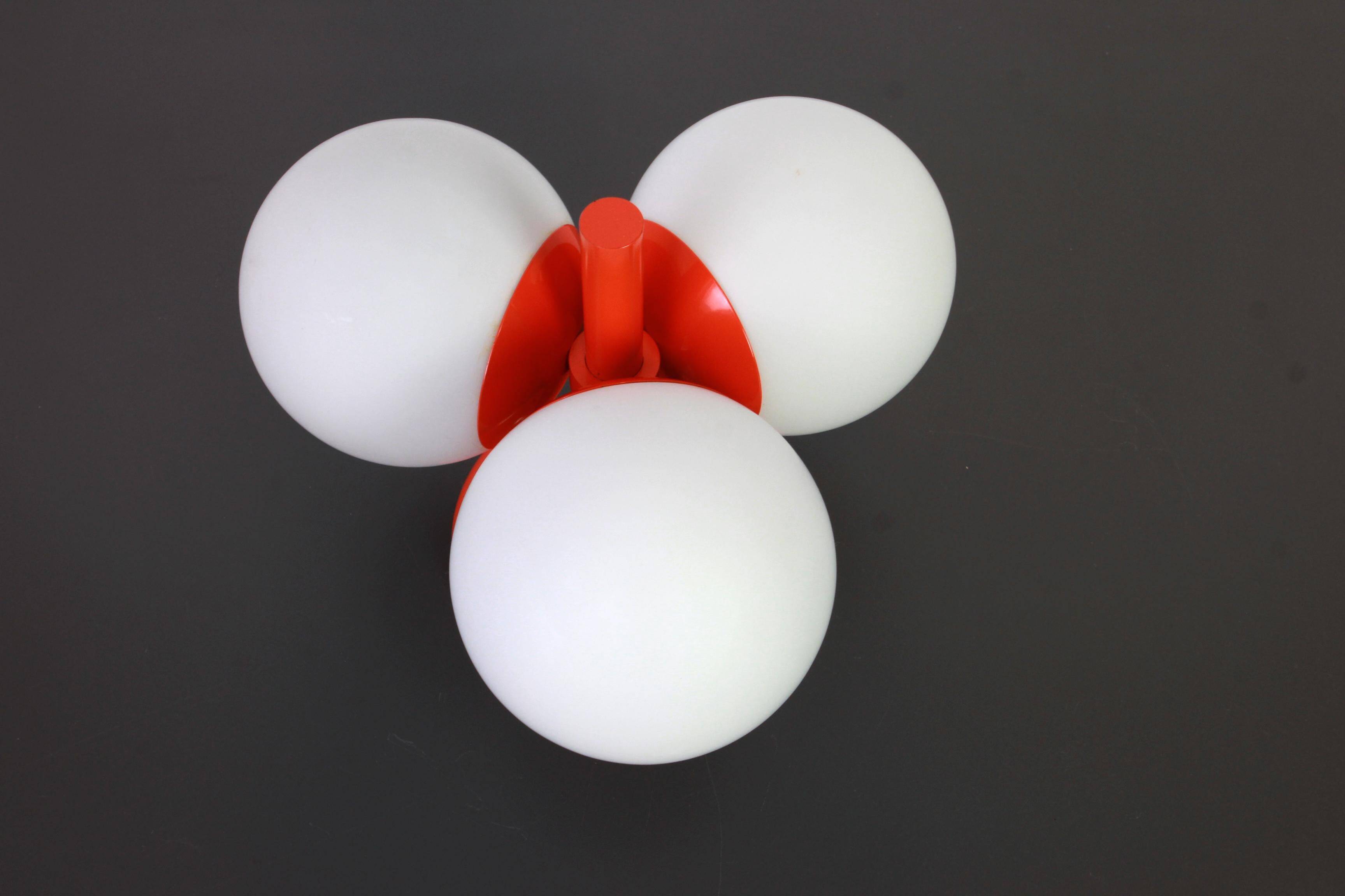 Small mid-century wall sconce in orange by Kaiser, Germany, 1960s