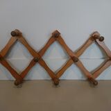 Folding wall coat rack