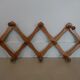 Folding wall coat rack