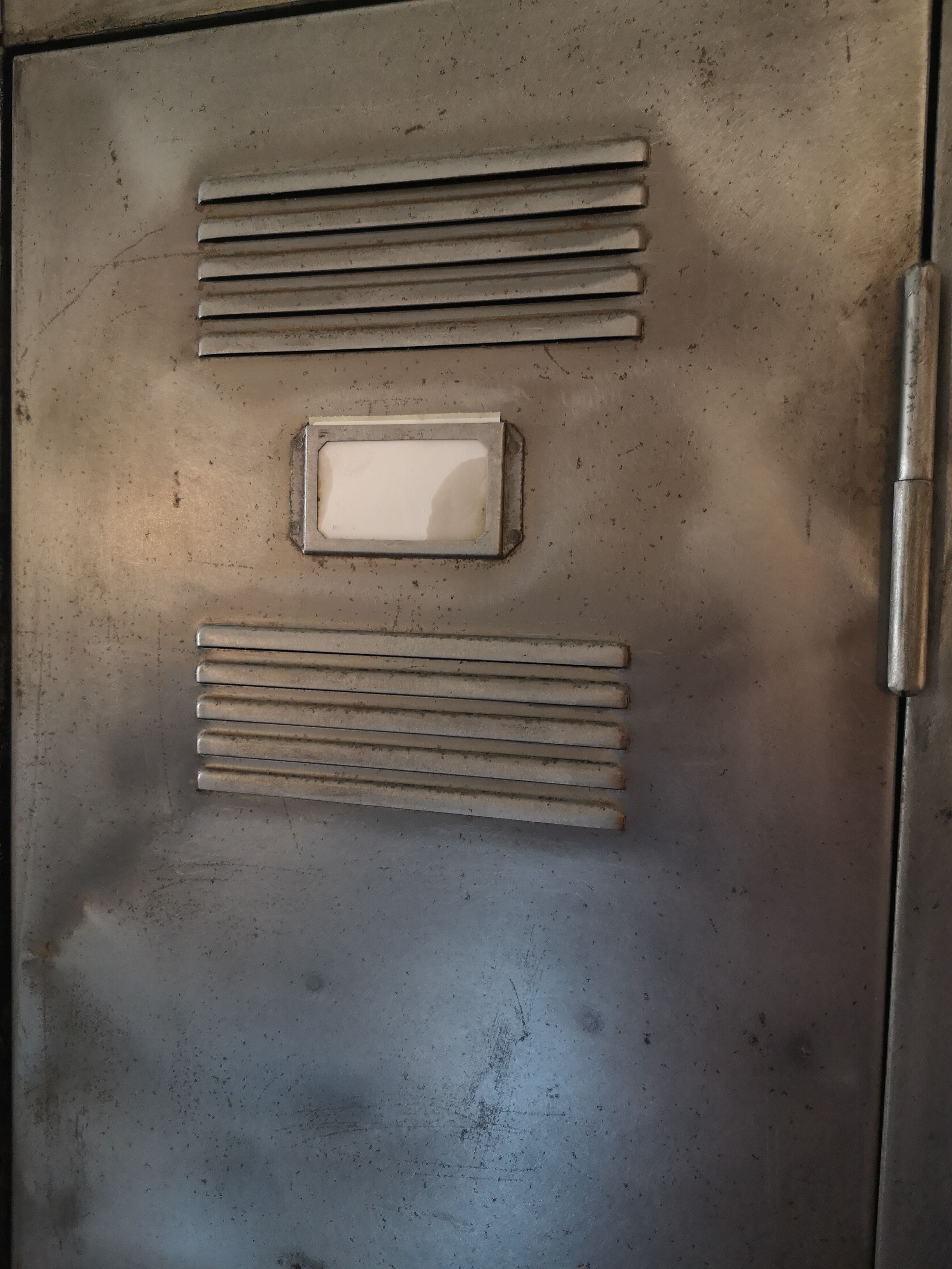 Cloakroom a waxed pickled metal door