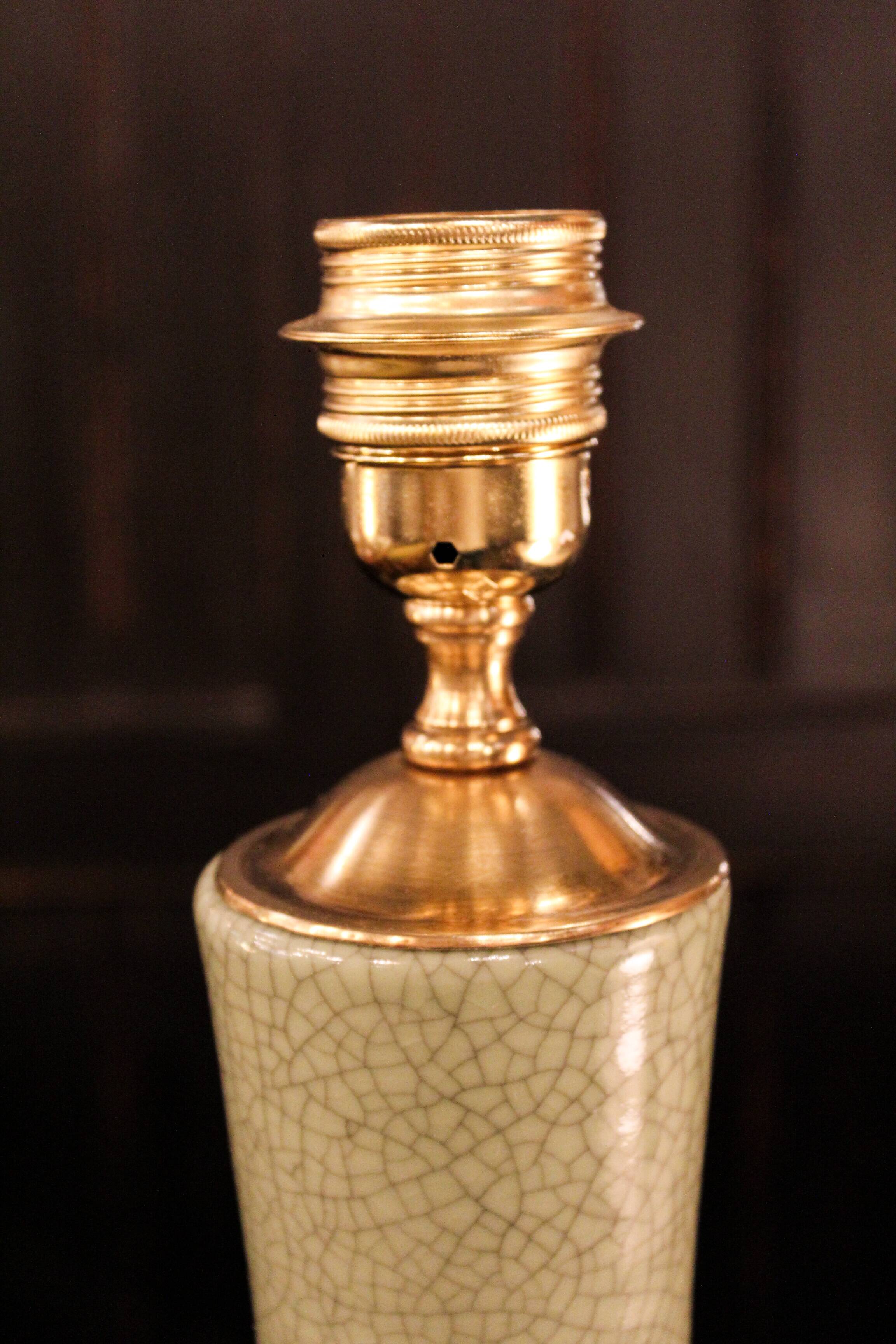 Ceramic lamp with a crackled celadon green finish.