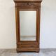 Armoire ancienne à miroir et décors sculptés