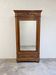 Armoire ancienne à miroir et décors sculptés