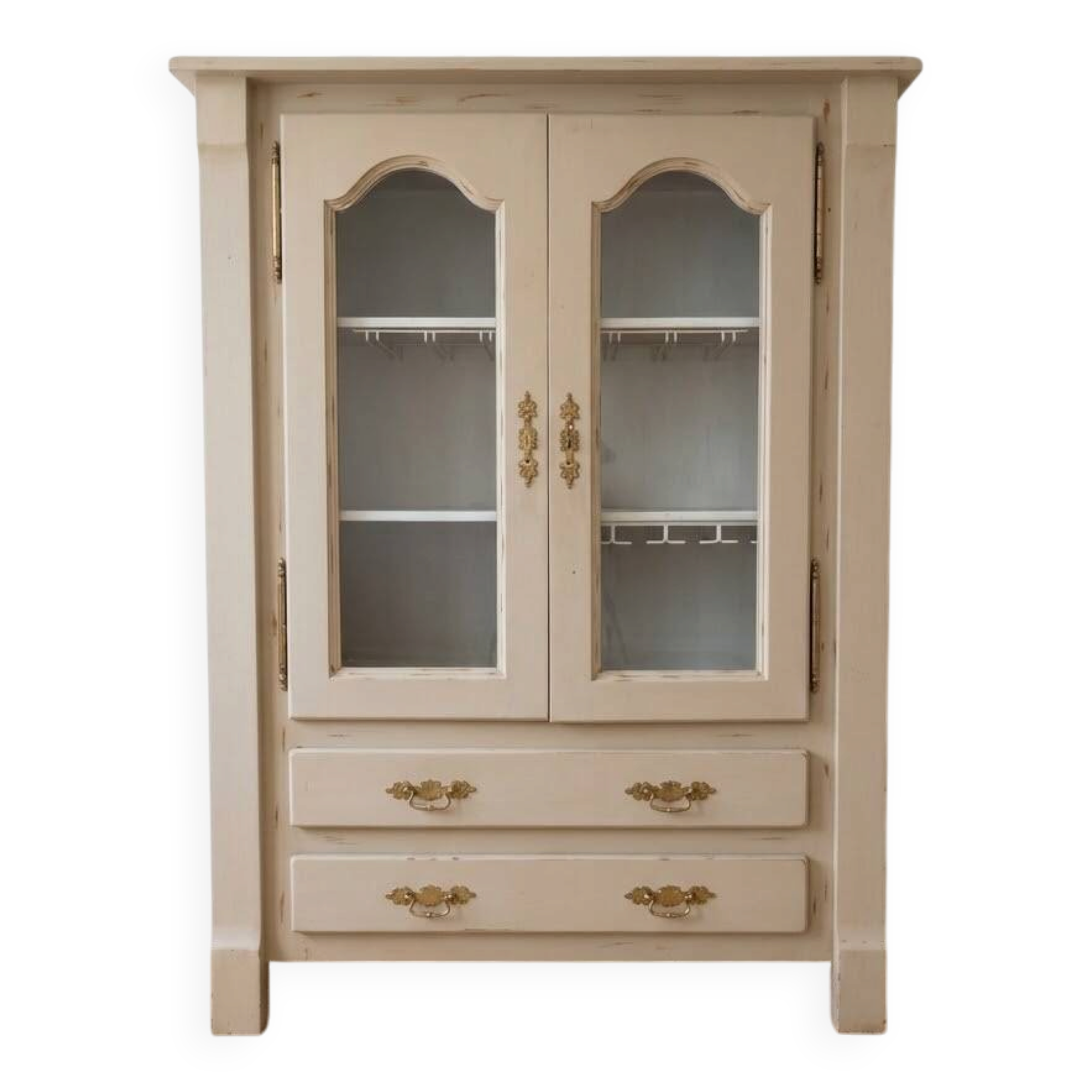 Antique beige wooden display cabinet with glass doors.