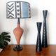 Pair of vintage metal diabolo candlesticks