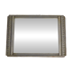 Art Deco mirror in silvered wood, stylised geometric frieze.