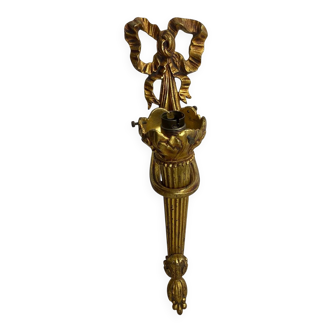 Bronze wall light, decorated with a bow and ribbon.