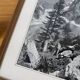 Framed old photo of a mountain landscape.