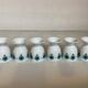 Six blue flower egg cups