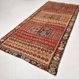 Kilim anatolien ancien tons rouges et beiges, motifs tribaux colorés