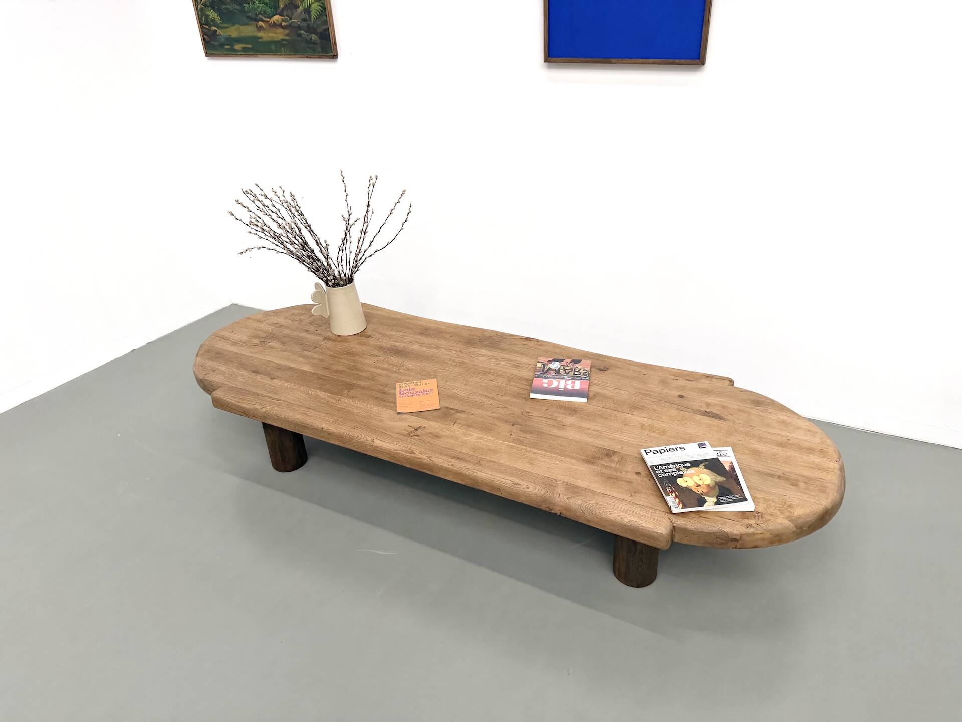 XXL oval coffee table in solid oak, cylindrical base, 1950s.