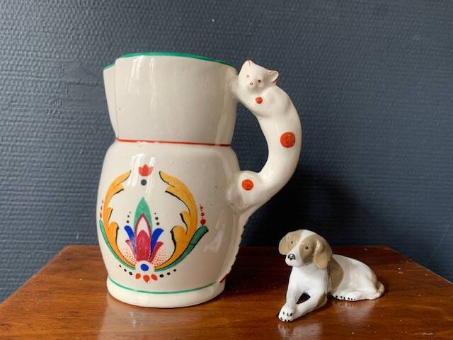 Hand-painted earthenware cream pot with cat handle, 19th century