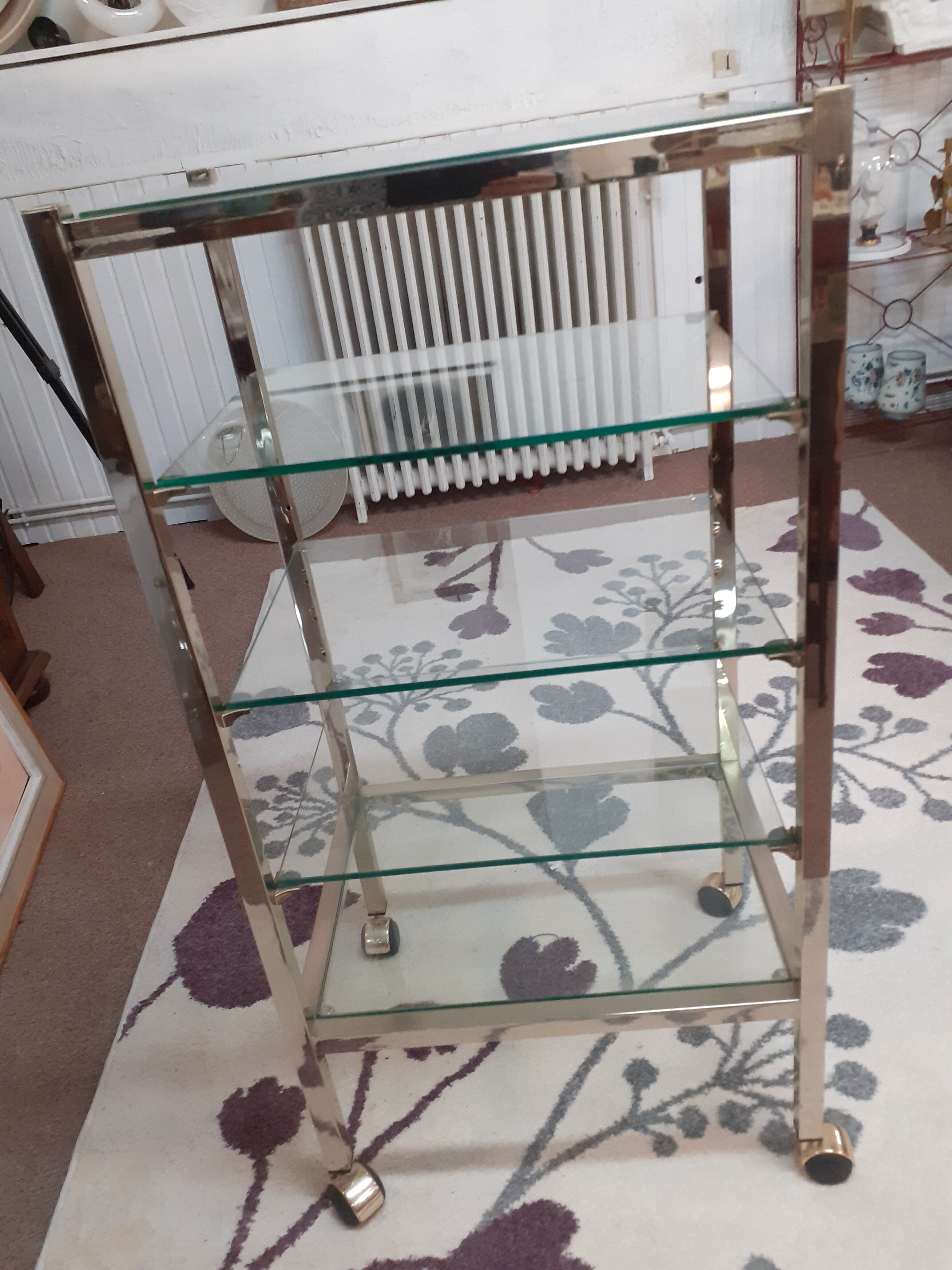 Glass and brass shelf on wheels