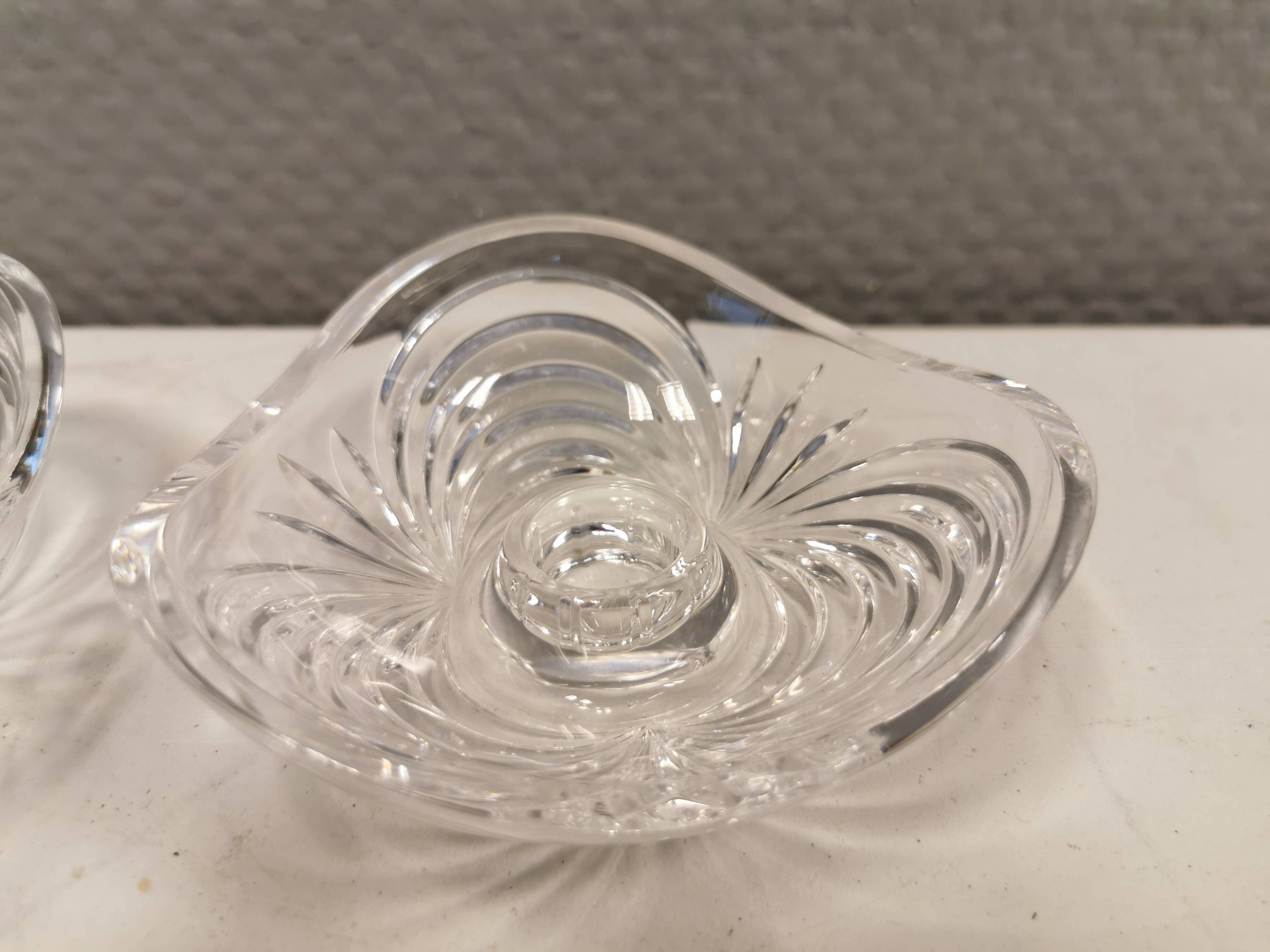A set of beautiful rock crystal glass candle holders from Swedish Orrefors. Estimated 1970s.