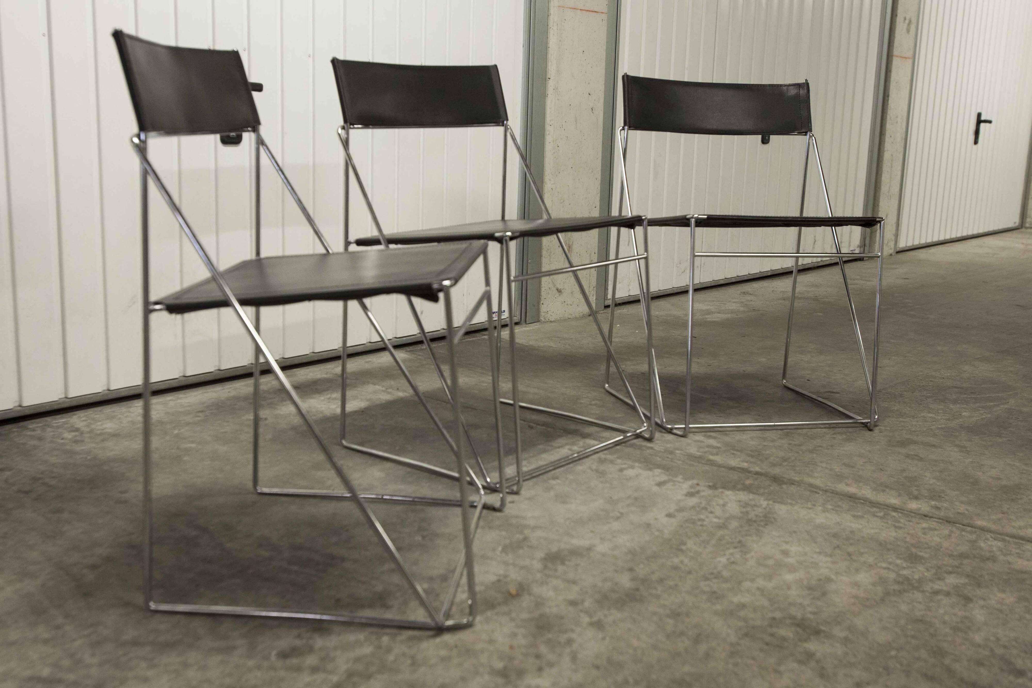 Set of 3 minimalist X line chairs by Niels Jorgen Haugesen.