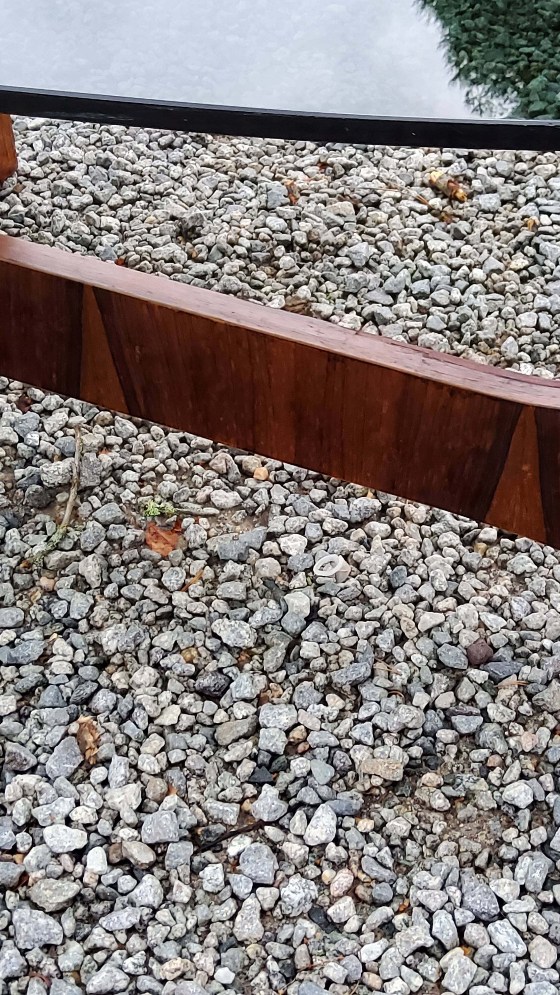 Designer coffee table by Hugues Poignant in rosewood and smoked glass from the 70s