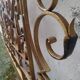 Golden wrought iron bedhead