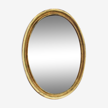 Oval mirror in gilded wood 67X52