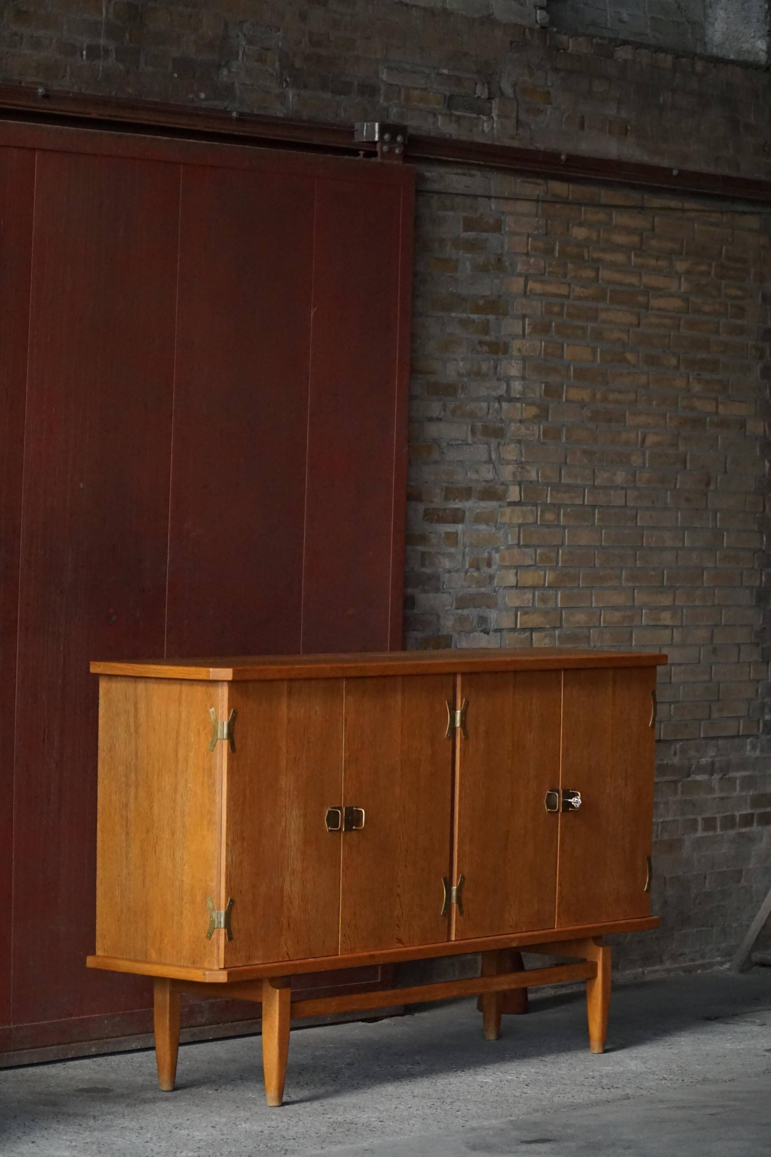 Oak and brass buffet by Henning Kjærnulf, Mid-century modern Danish, 1960s.