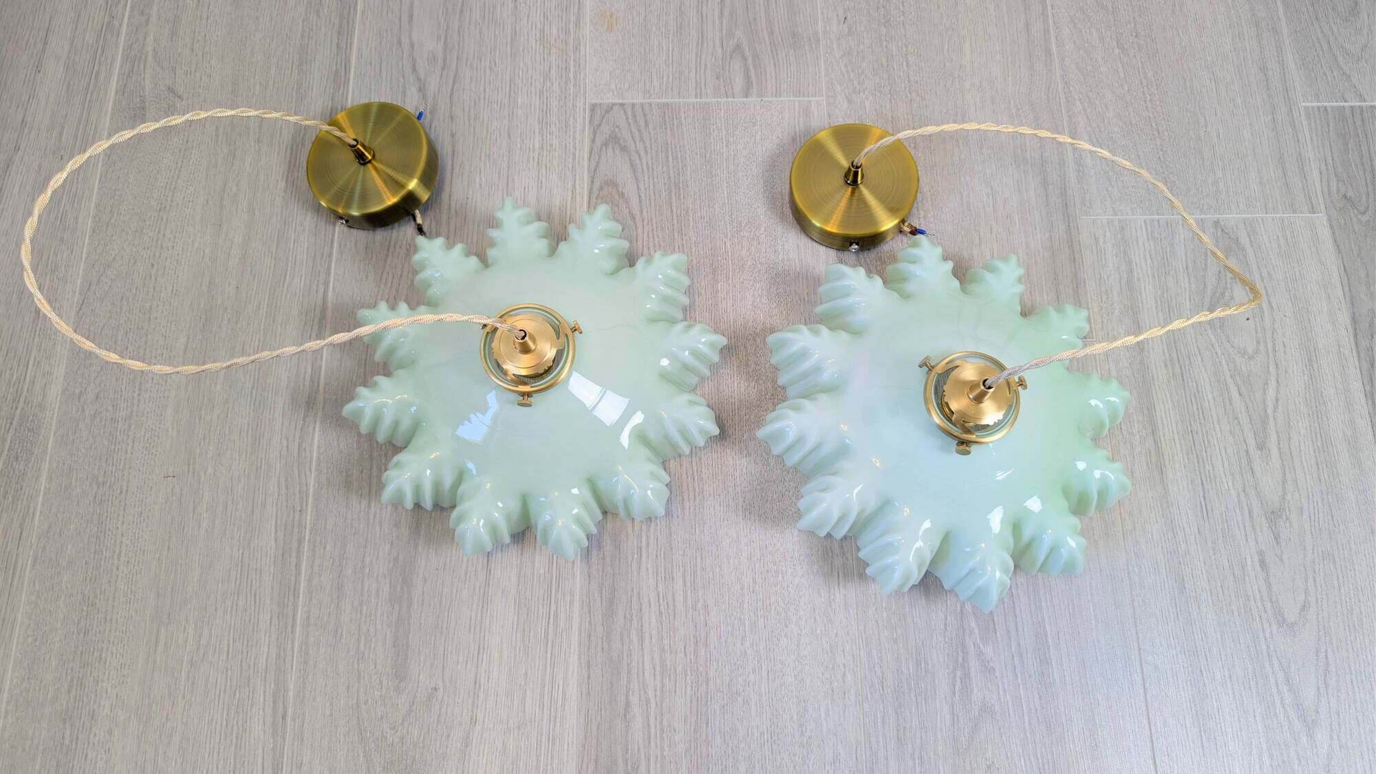 Pair of green opaline glass pendant lights – frosted poetry & Art Deco brilliance