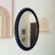 Vintage oval mirror in petrol blue wood