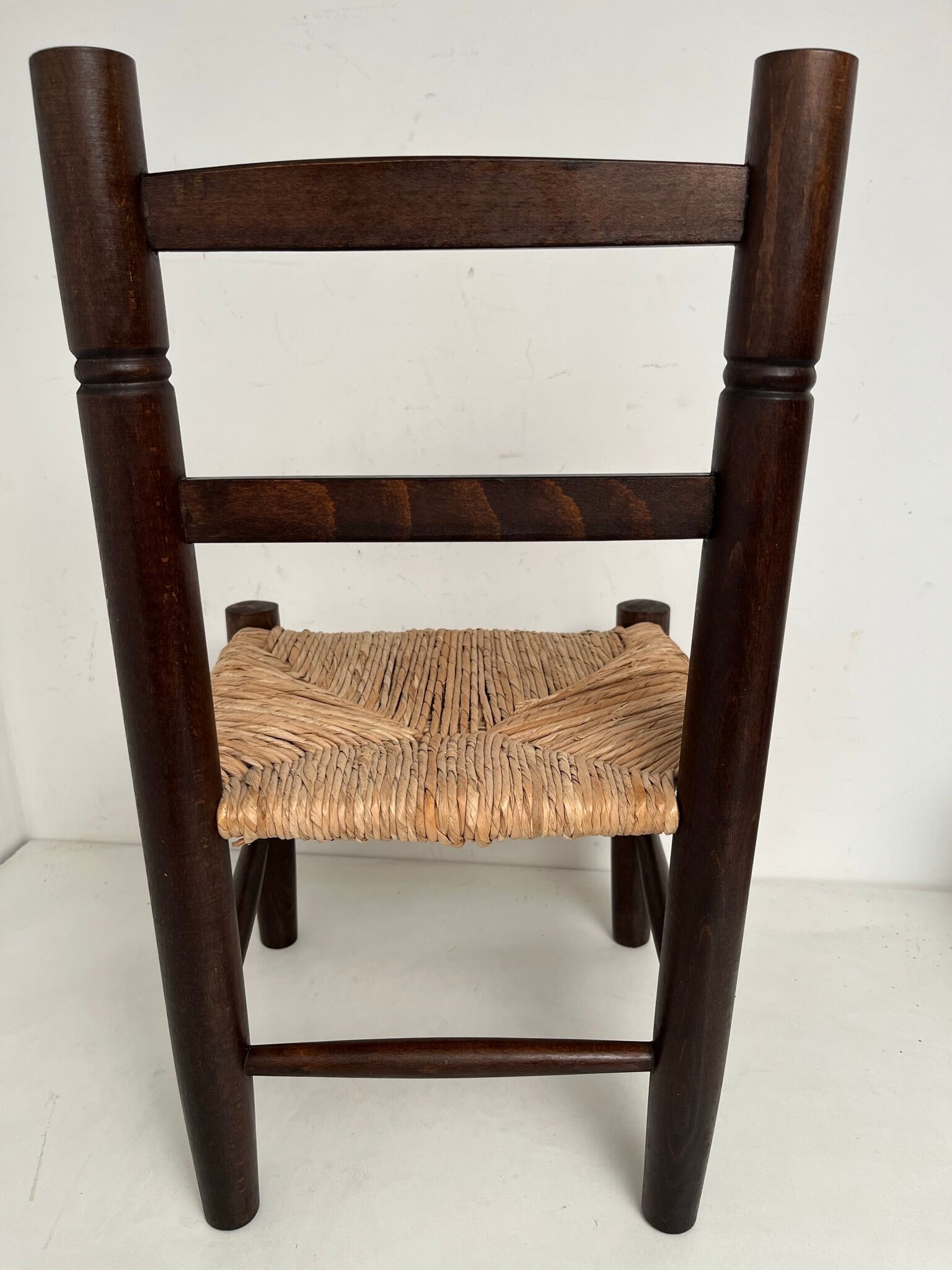 Wooden children's chair with vintage straw seat
