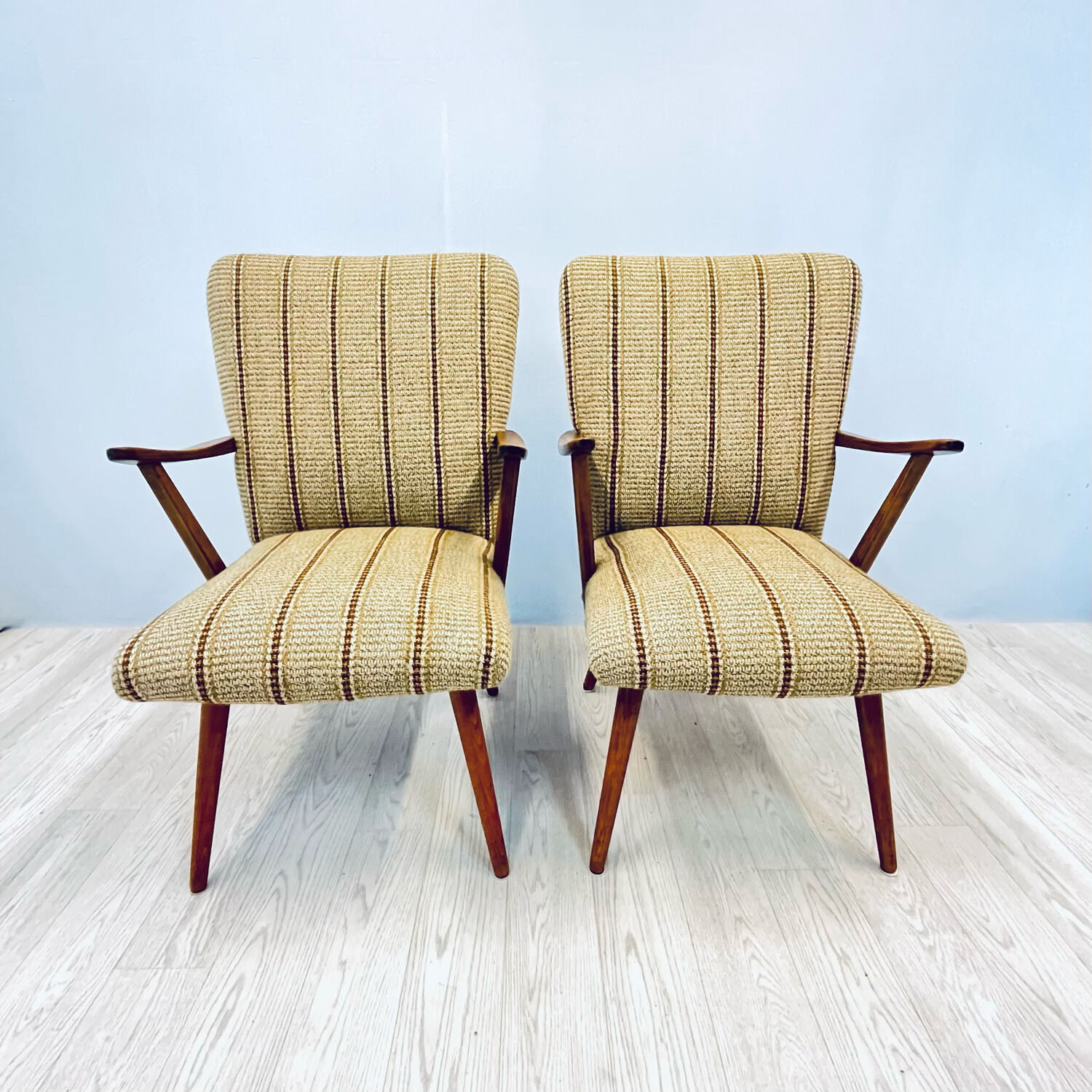 A pair vintage cocktail chairs with stripes and metal screws