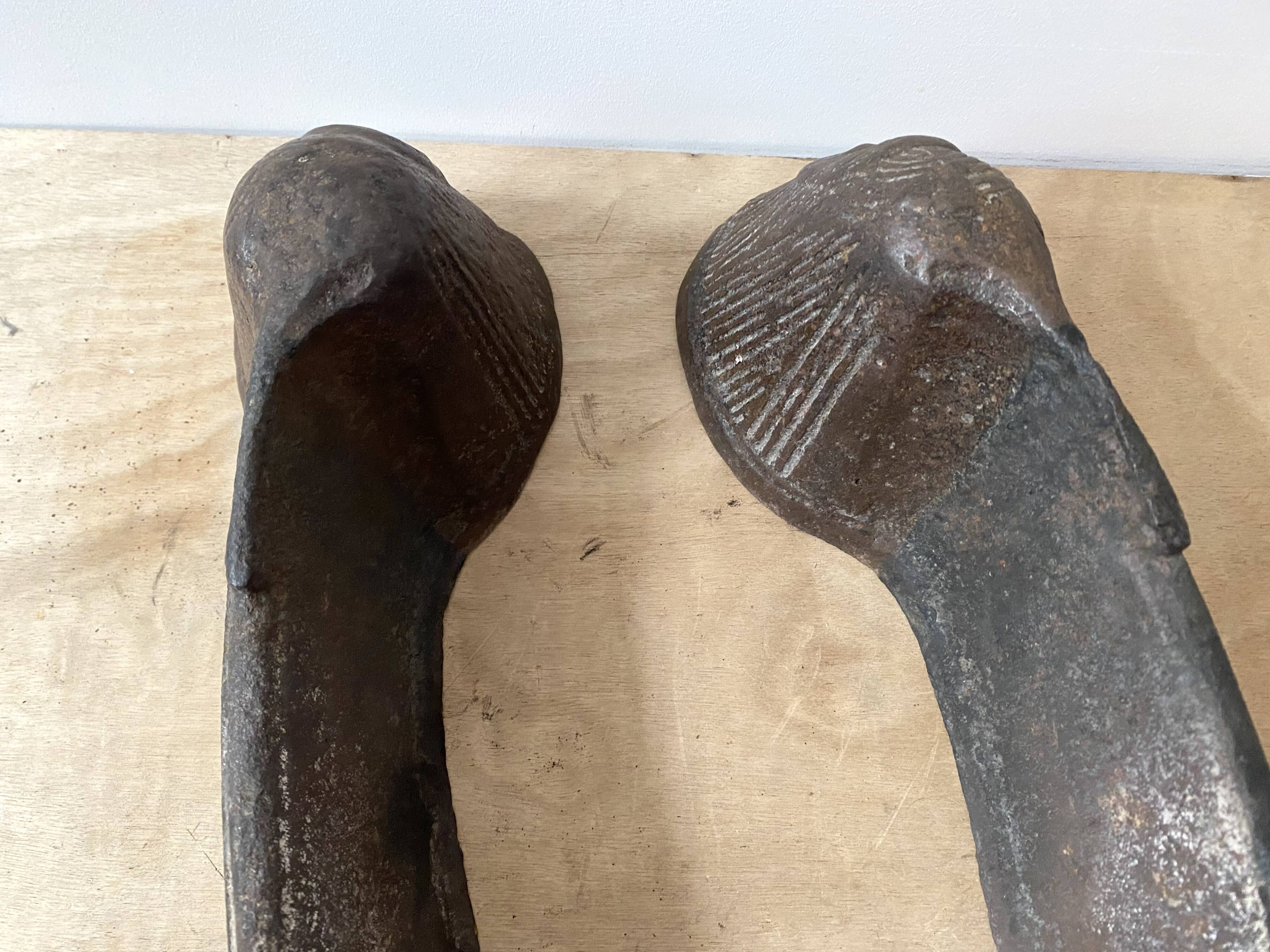 Pair of modernist anthropomorphic fireplace andirons, brutalist log holders 1950s