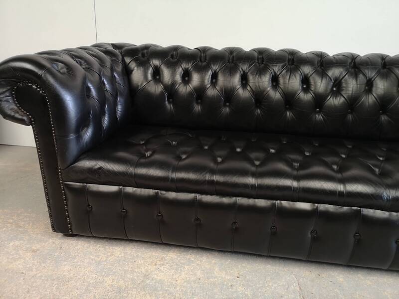 Black leather chesterfield sofa