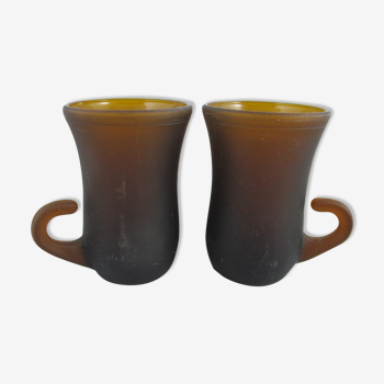 pair of small brown glass cups