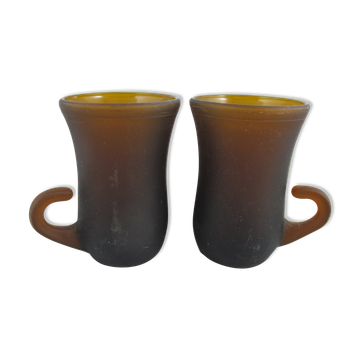 pair of small brown glass cups