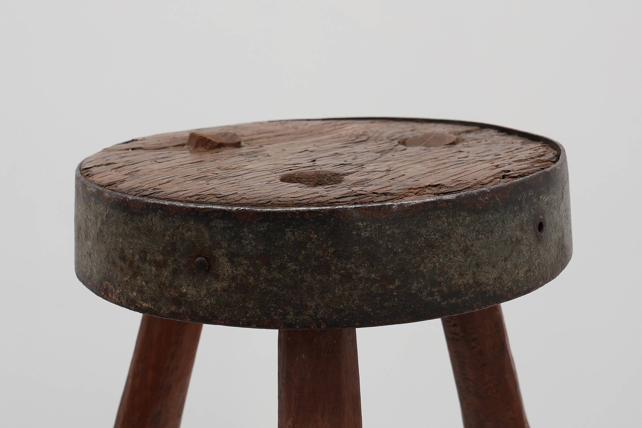 Brutalist French solid oak tripod stool with metal rim, 1850s