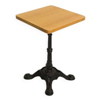 Solid stained oak table with cast iron bistro base