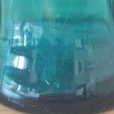 Blown glass vase with a flared neck and wavy rim.