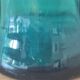 Blown glass vase with a flared neck and wavy rim.