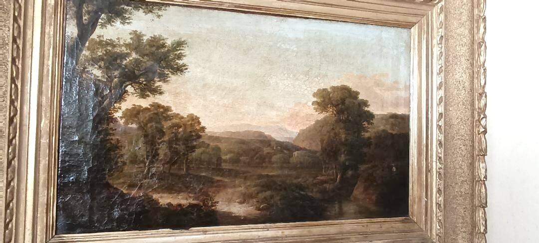 Antique painting on canvas depicting a bucolic landscape