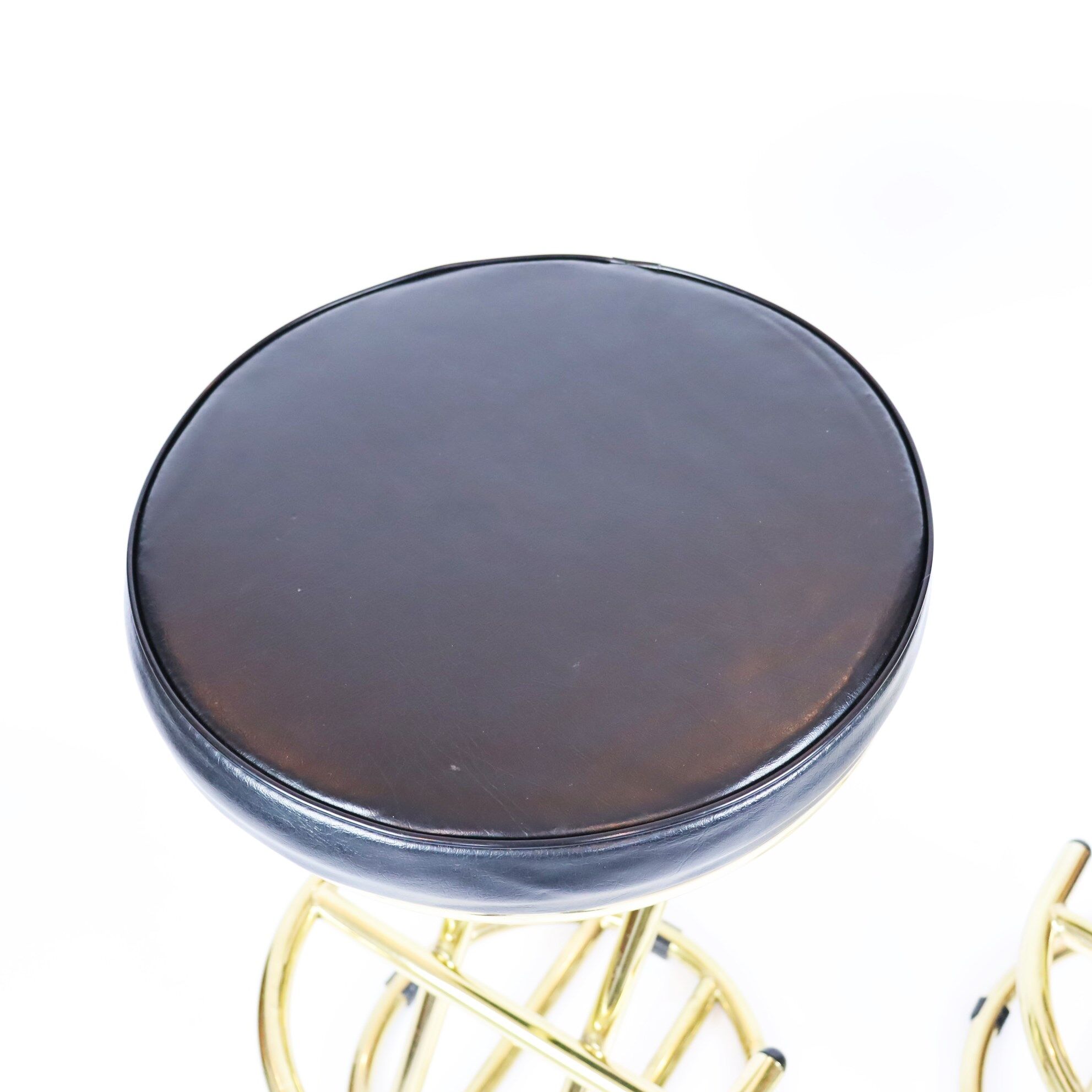 Pair of high brass stools