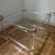 2 side tables in plexiglass, glass, and brass.