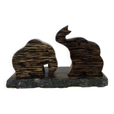 Vintage palm wood elephant salt and pepper shakers.