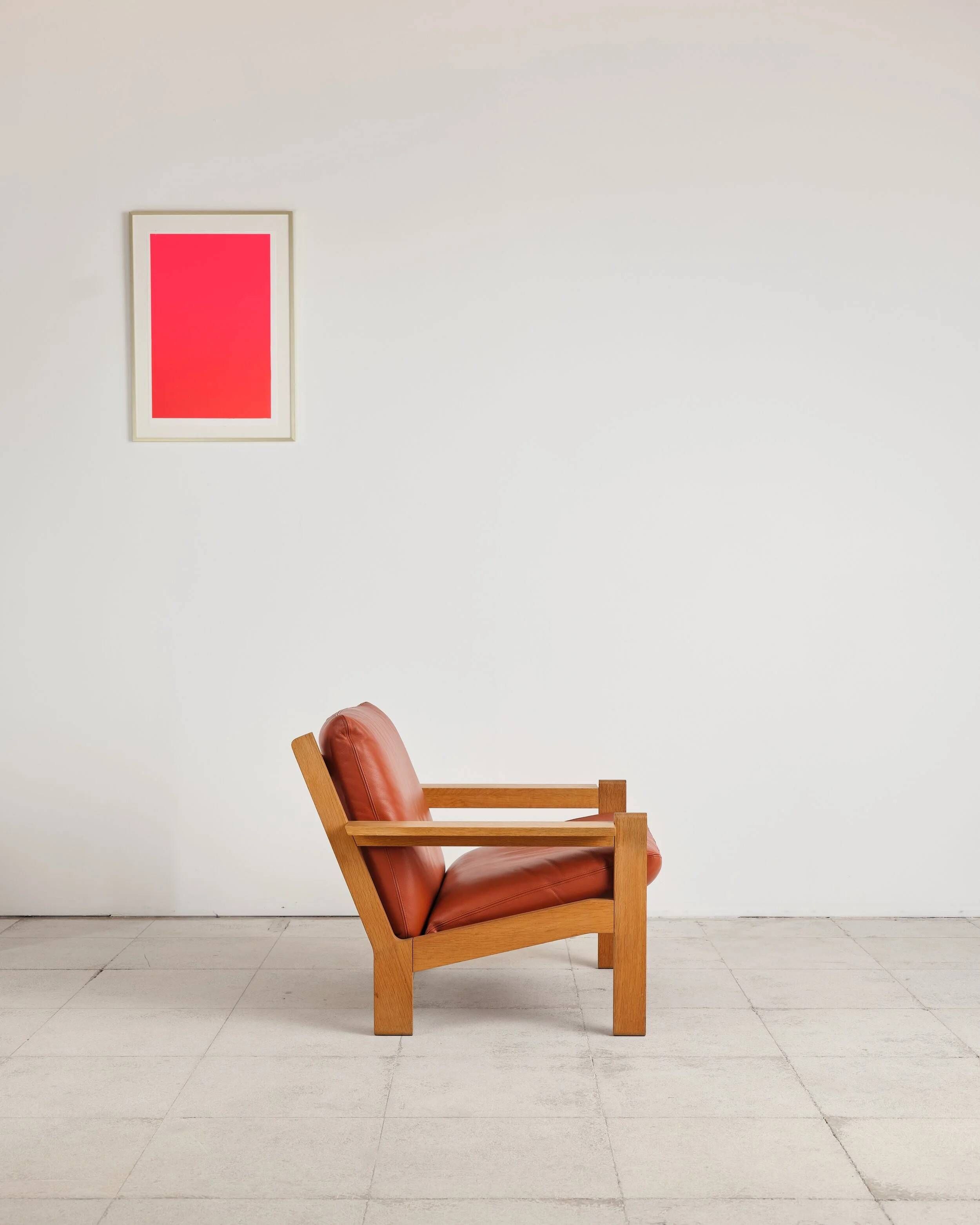 Brutalist armchair in oak and leather by Tage Poulsen, Denmark, 1970s.