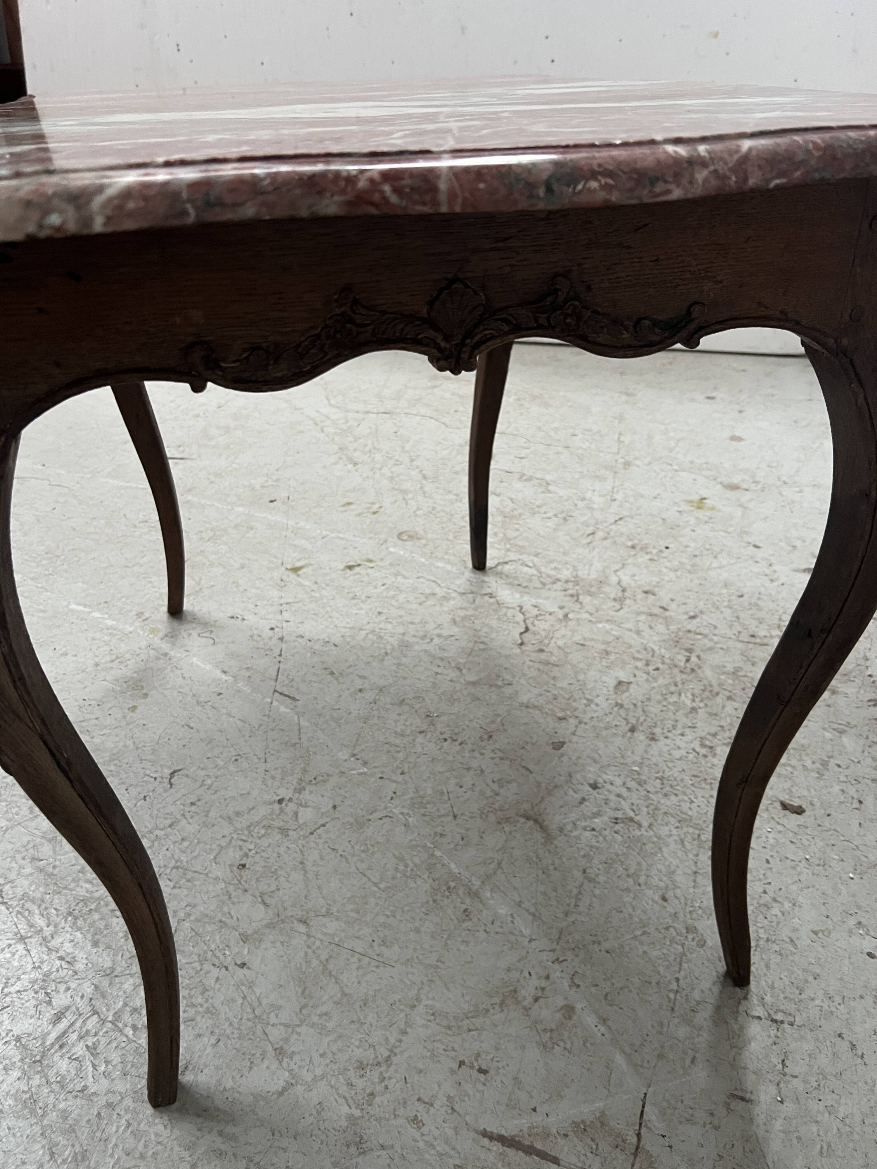 Louis XV mid-table in oak and marble, 18th century.