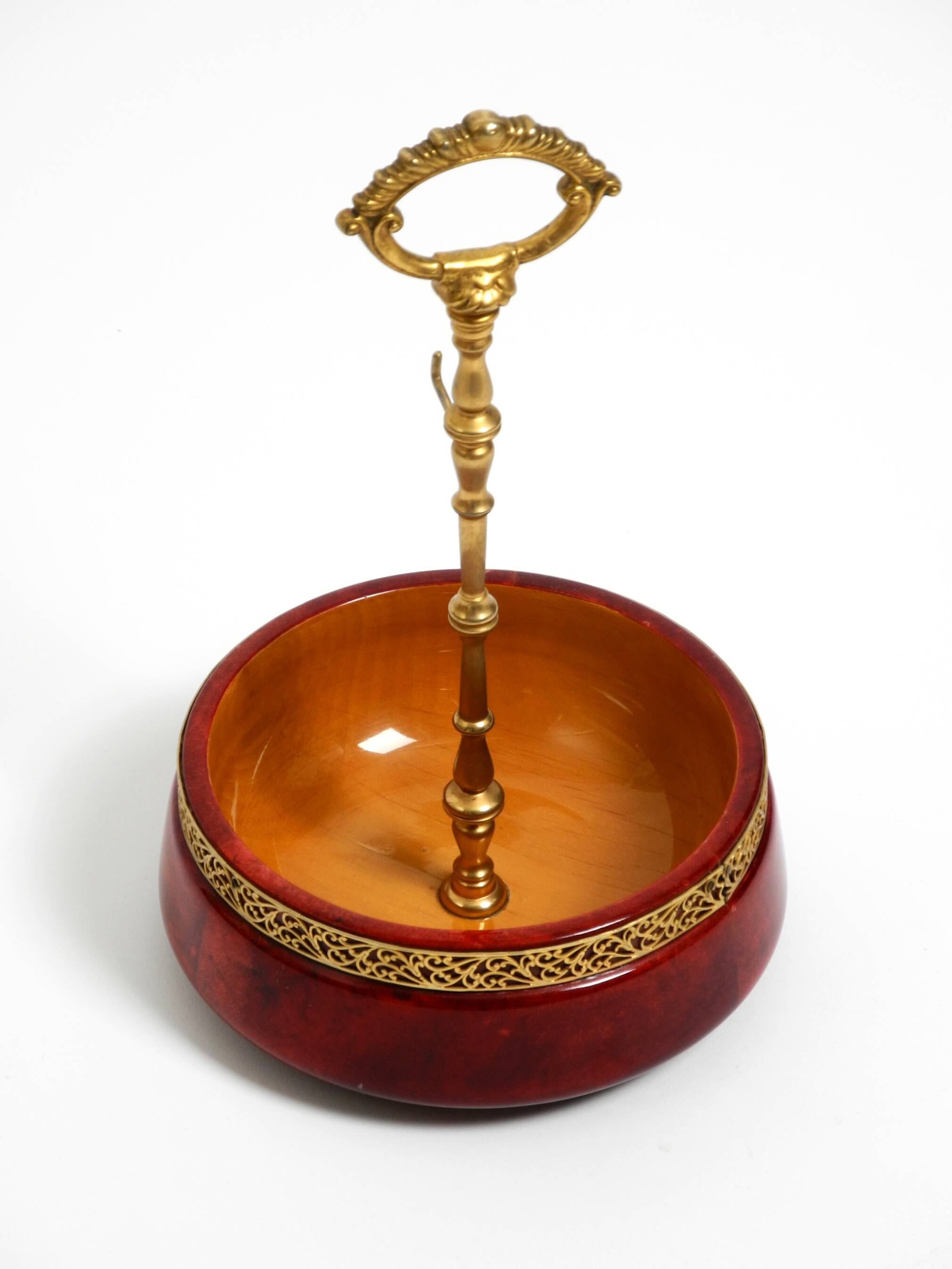 Beautiful 1960s nut bowl by Aldo Tura made of red goatskin and brass