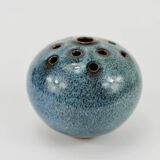 Vase with blue flowers.