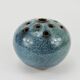 Vase with blue flowers.