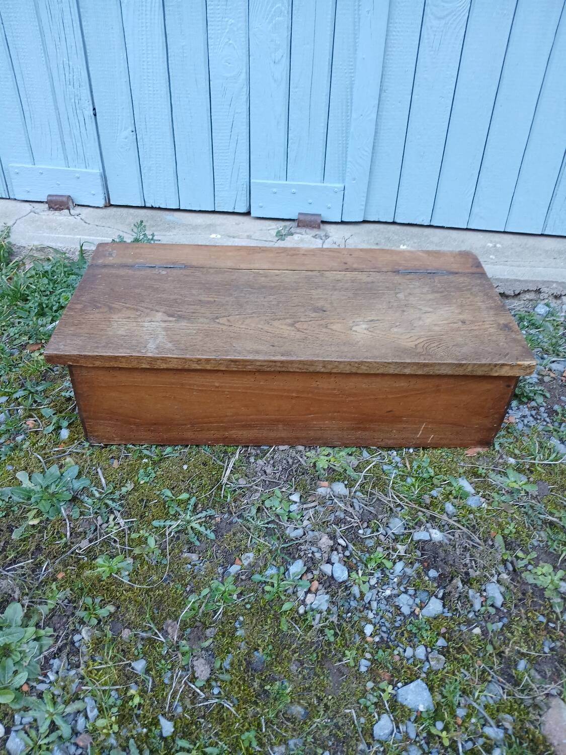 Small old wooden chest with hinged lid